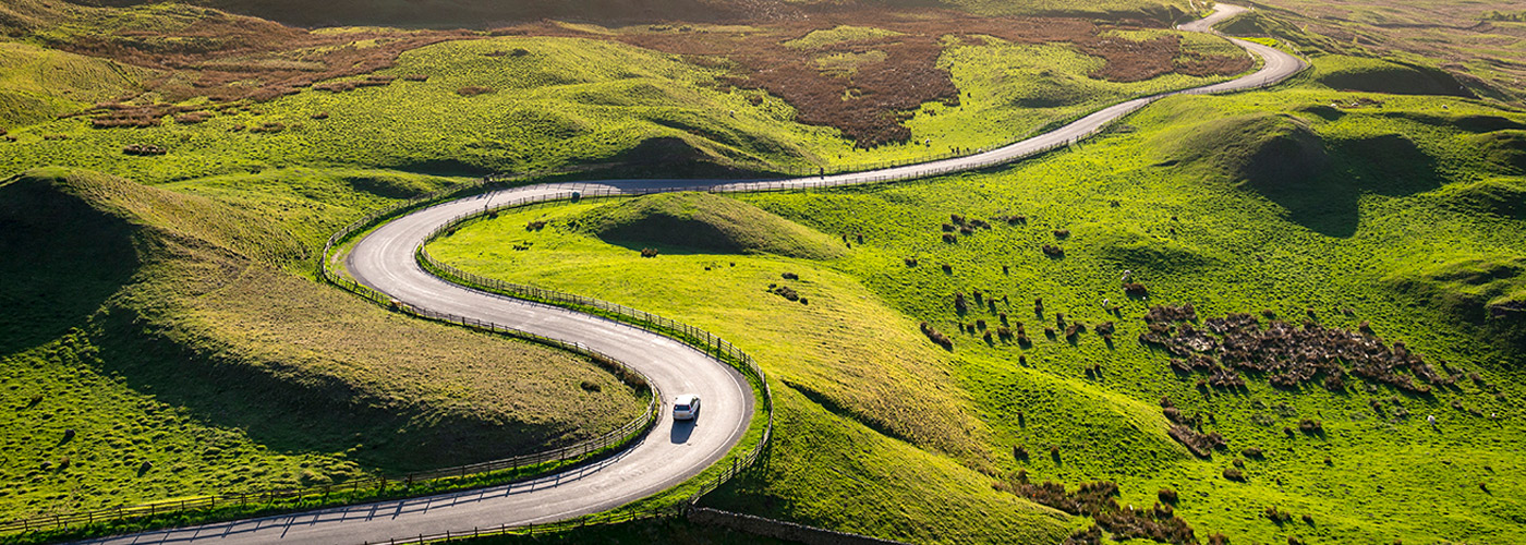 Automotive navigating open road Automotive driving winding road with confidence
